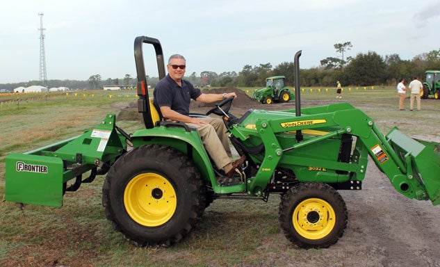 Author on a 2014 John Deere 3032E